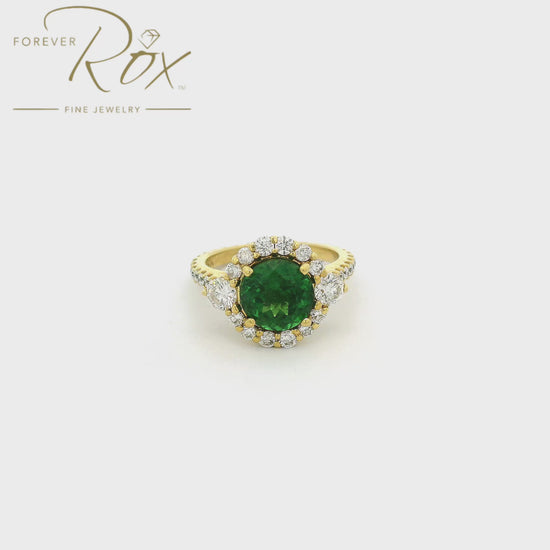 A Yellow Gold Ring with a prong set round cut natural Tsavorite Garnet in the center with a multi size diamond halo and diamond eternity shank at Forever Rox Fine Jewelry, Lake Tahoes Best Jewelry Store
