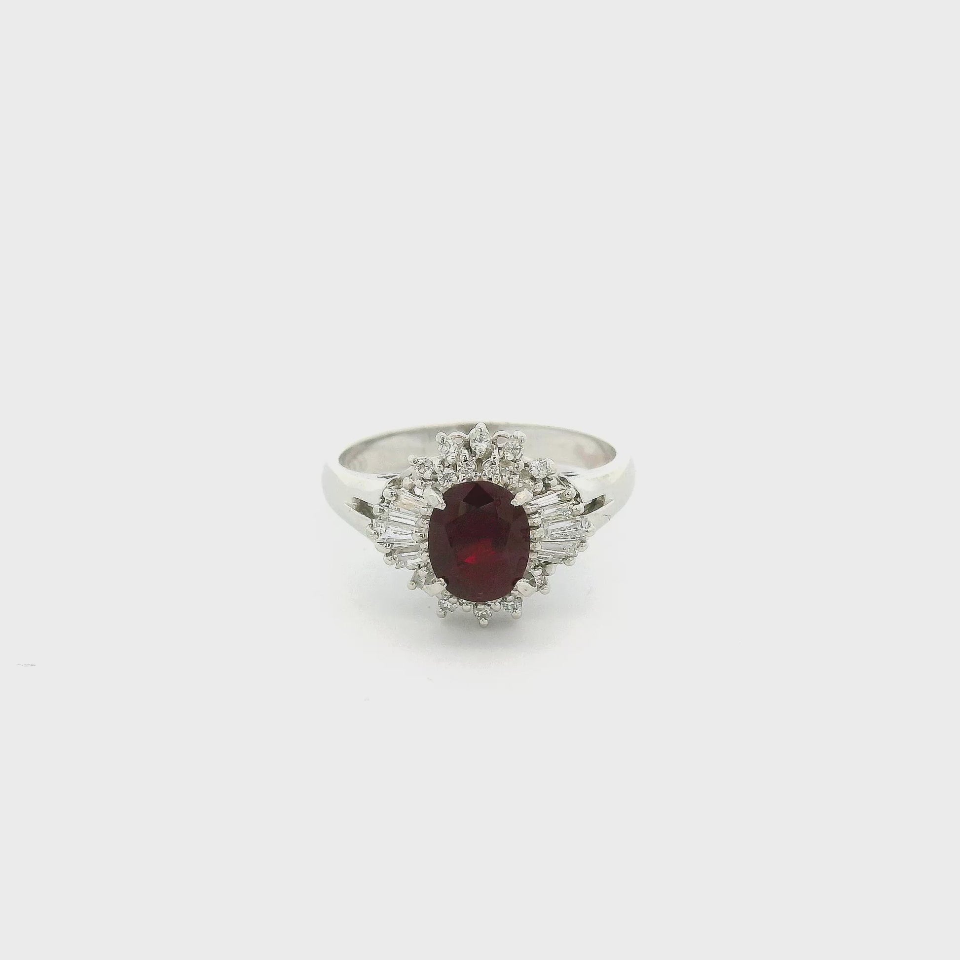 A Platinum Ring with a prong set oval cut natural Ruby in the center with Baguette and round cut diamonds at Forever Rox Fine Jewelry, Lake Tahoes Best Jewelry Store