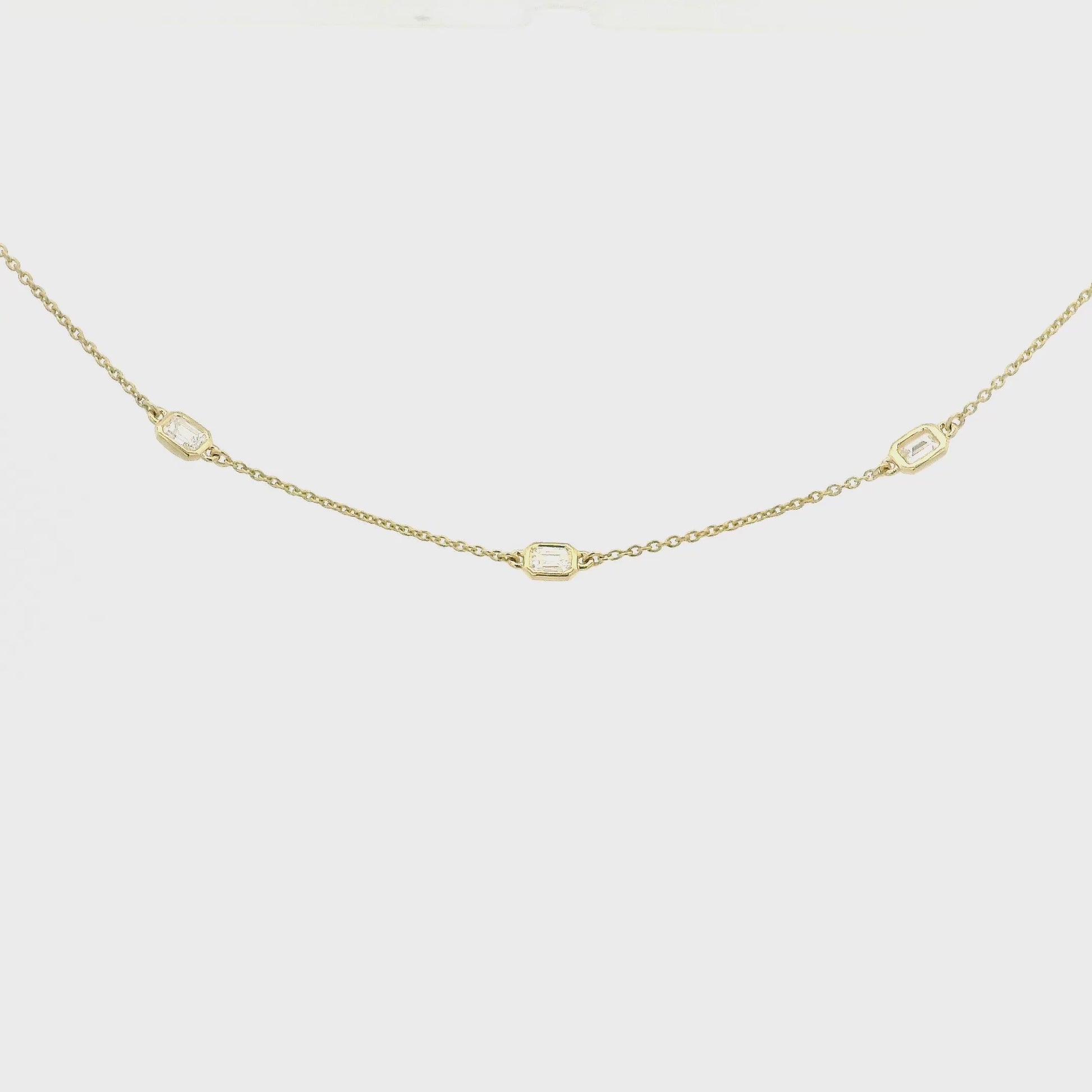 A Yellow Gold Necklace with bezel set emerald cut natural Diamondsset in the chain at Forever Rox Fine Jewelry, Lake Tahoes Best Jewelry Store