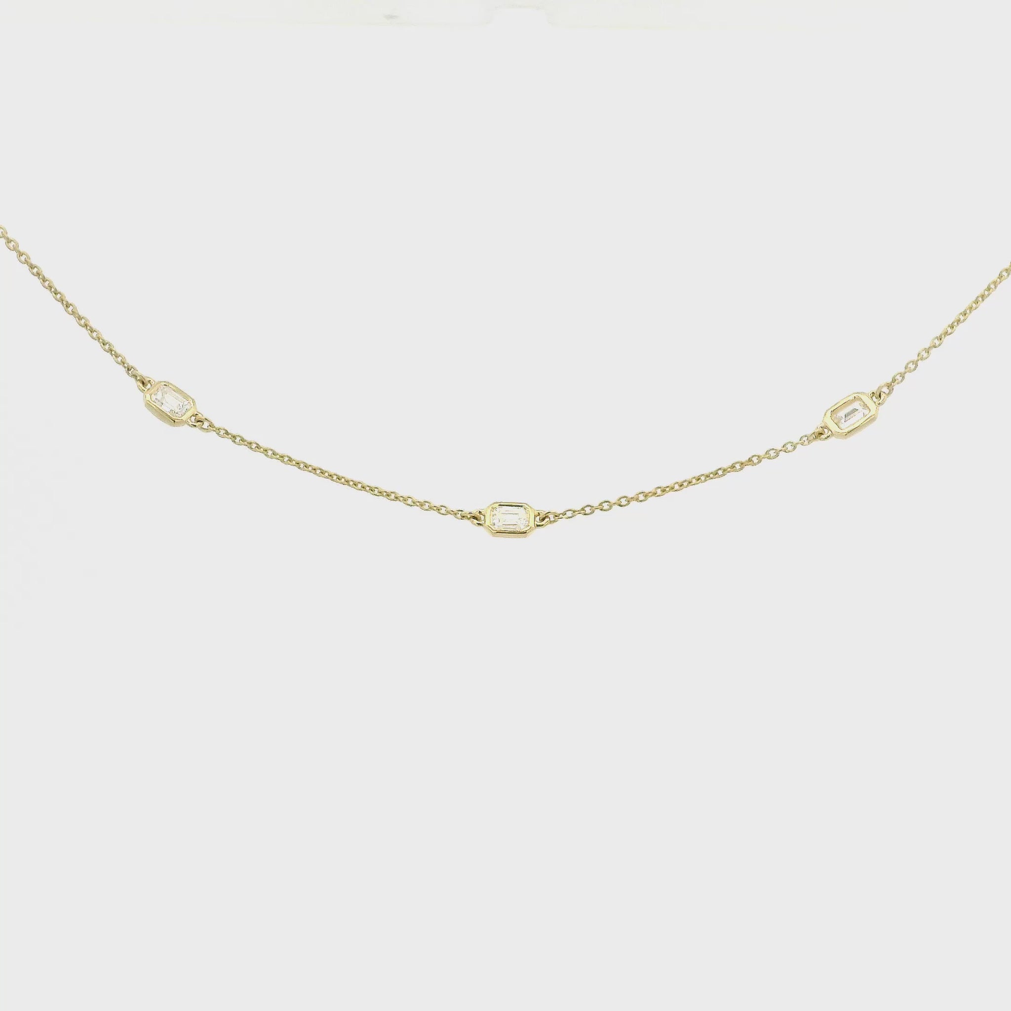 A Yellow Gold Necklace with bezel set emerald cut natural Diamondsset in the chain at Forever Rox Fine Jewelry, Lake Tahoes Best Jewelry Store