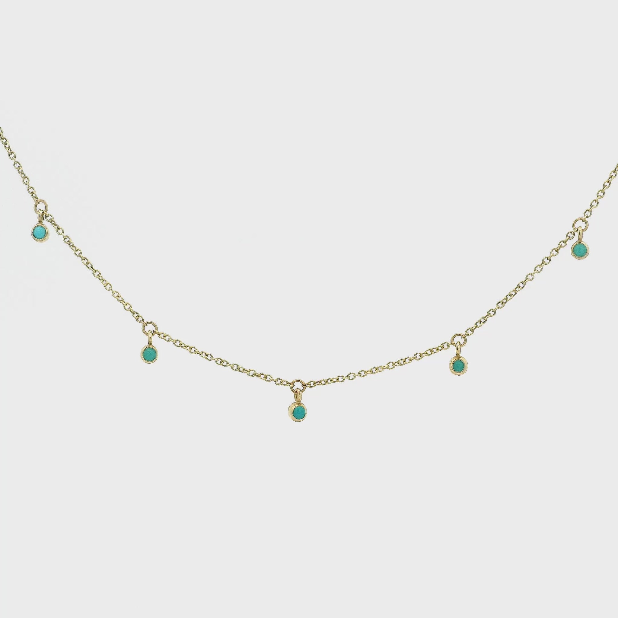 Turquoise Studded Links Hanging From a Necklace at Forever Rox Fine Jewelry