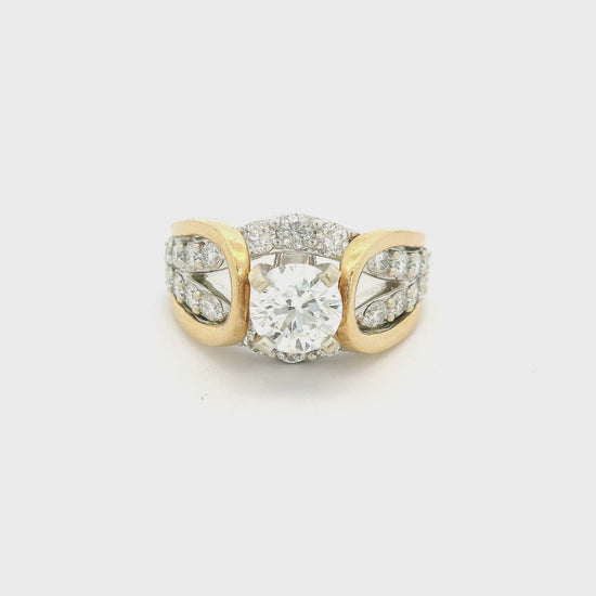 Gold & White gold ring in a know design with a round cut diamond in the center and down the shank at Forever Rox Fine Jewelry