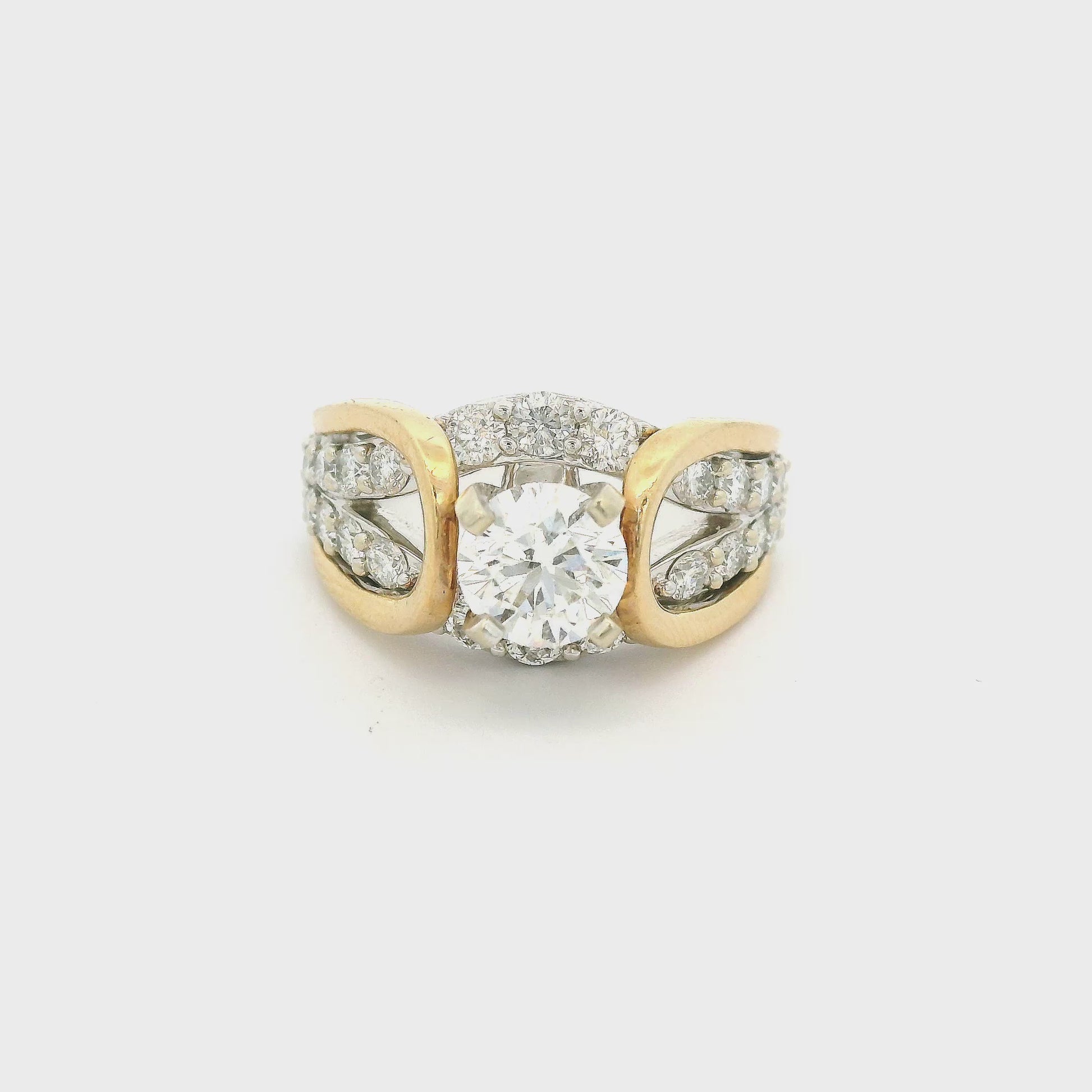 Gold & White gold ring in a know design with a round cut diamond in the center and down the shank at Forever Rox Fine Jewelry