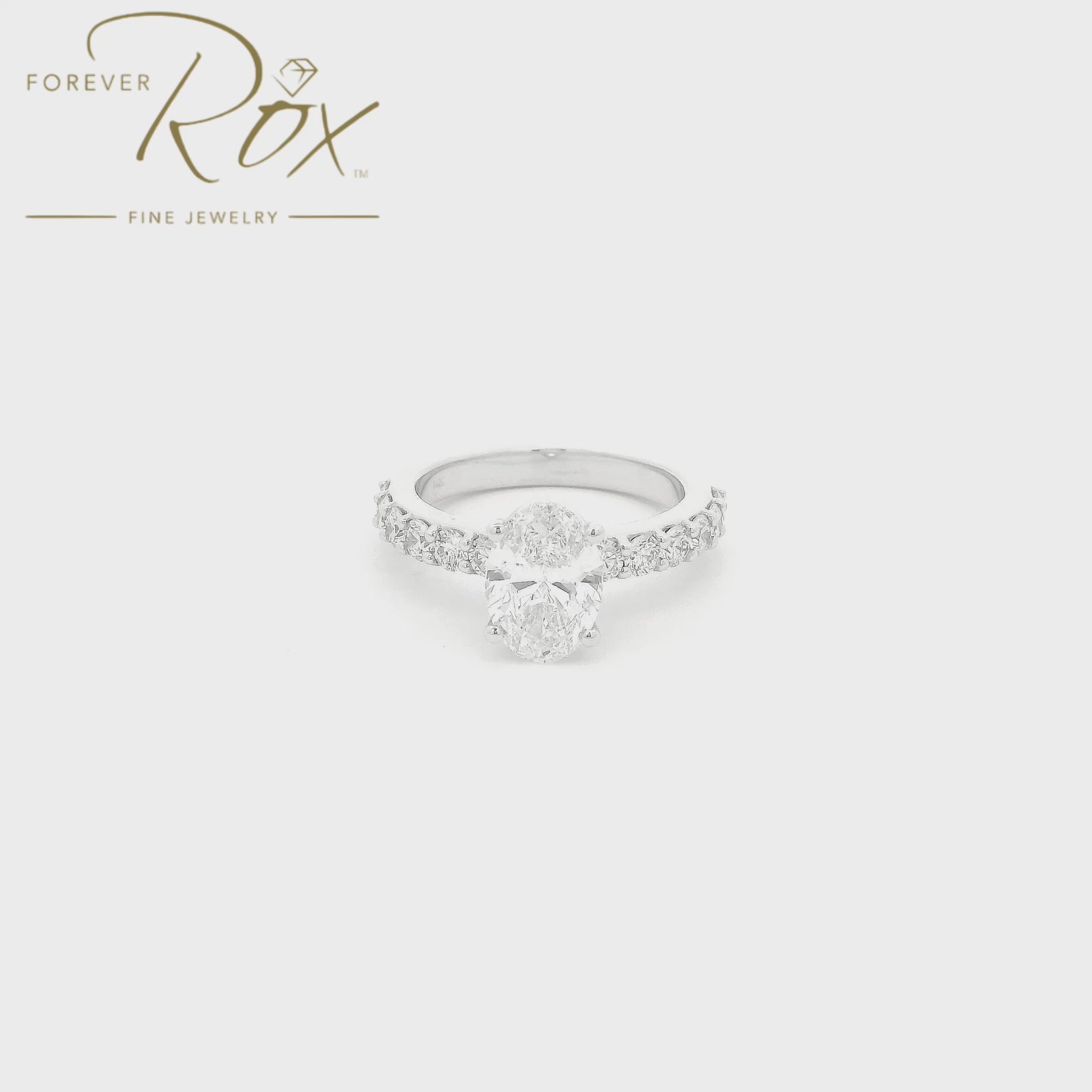 Custom 14k white gold oval diamond engagement ring with GIA certified 1.21ct D color SI1 natural diamond and 0.60ct diamond band by Forever Rox Fine Jewelry, Lake Tahoes Best Jewelry Store