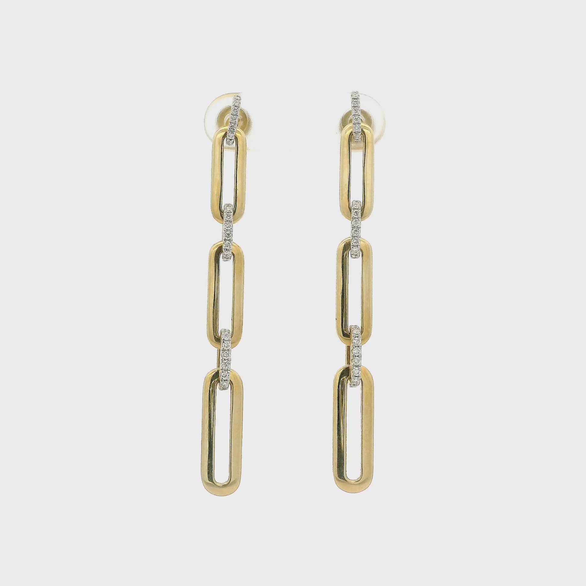 A Pair of Yellow Gold Earrings with paperclip Diamond links dangling at Forever Rox Fine Jewelry, Lake Tahoes Best Jewelry Store