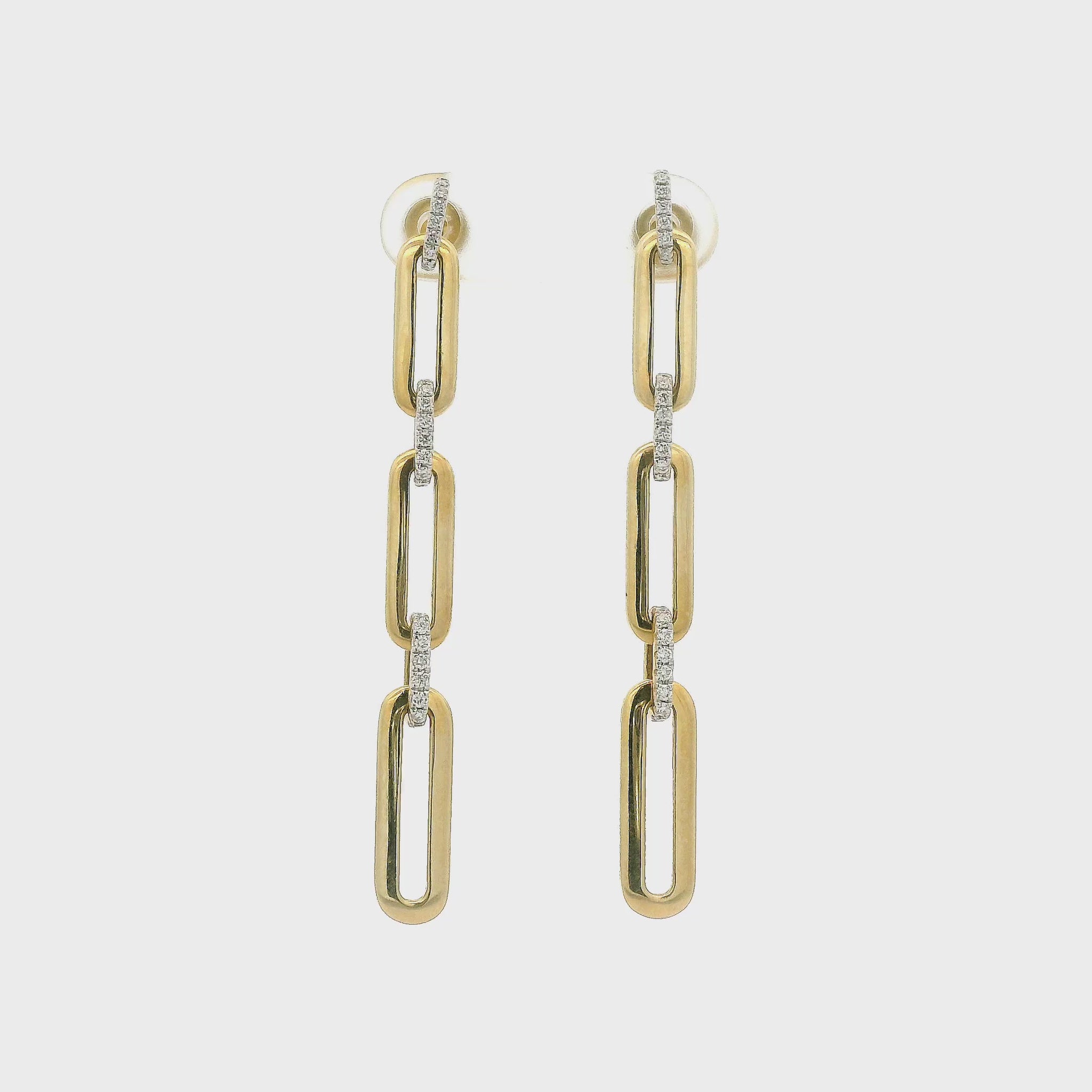 A Pair of Yellow Gold Earrings with paperclip Diamond links dangling at Forever Rox Fine Jewelry, Lake Tahoes Best Jewelry Store