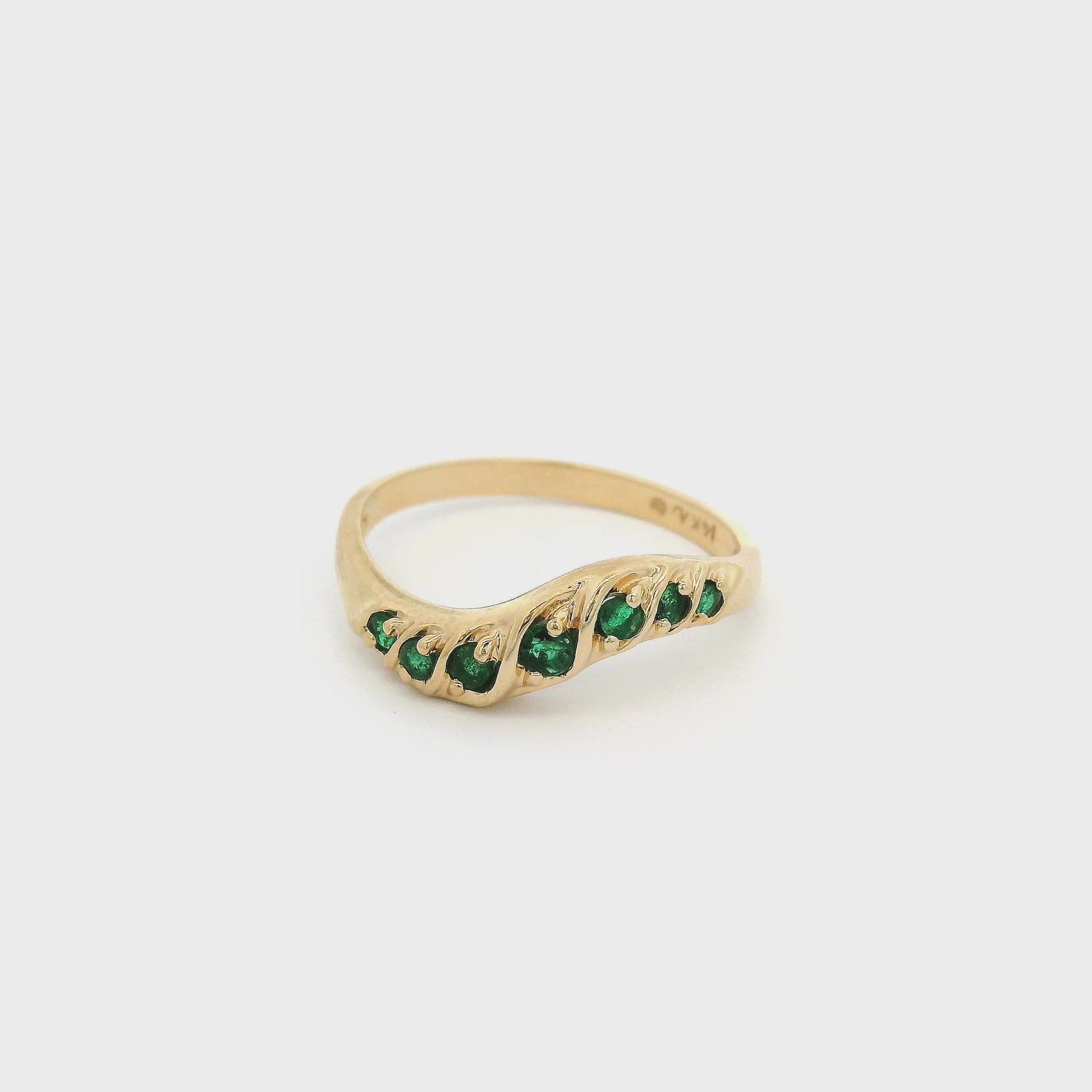 Yellow Gold Curved Stackable Band with seven emeralds at Forever Rox Fine Jewelry