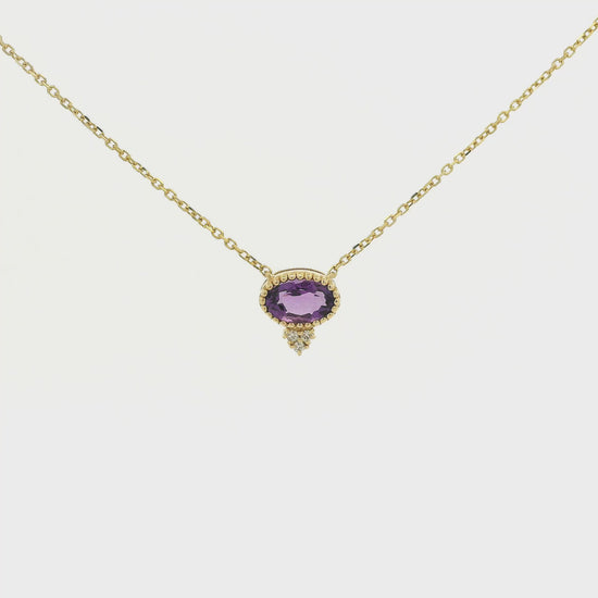 A Yellow Gold Pendant with a milgrain bezel set oval cut natural Amethyst in the center with 3 diamonds and a chain attached at Forever Rox Fine Jewelry, Lake Tahoes Best Jewelry Store