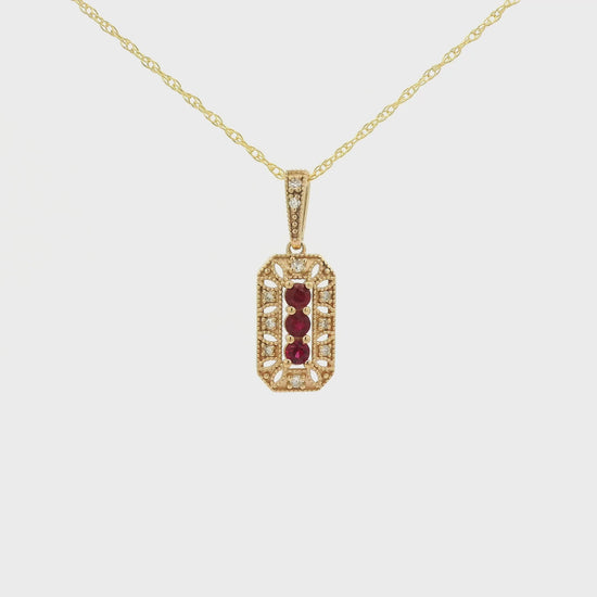 Yellow Gold Pendant with 3 prong set round cut natural Rubies in the center filigree design and diamonds at Forever Rox Fine Jewelry, Lake Tahoes Best Jewelry Store
