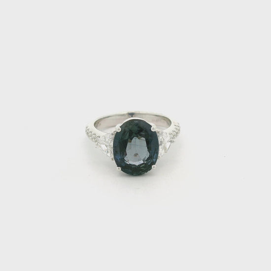 A White Gold Ring with a prong set oval cut natural Color Change Sapphire in the center with two chevron cut natural diamonds and round cut diamonds Forever Rox Fine Jewelry, Lake Tahoes Best Jewelry Store