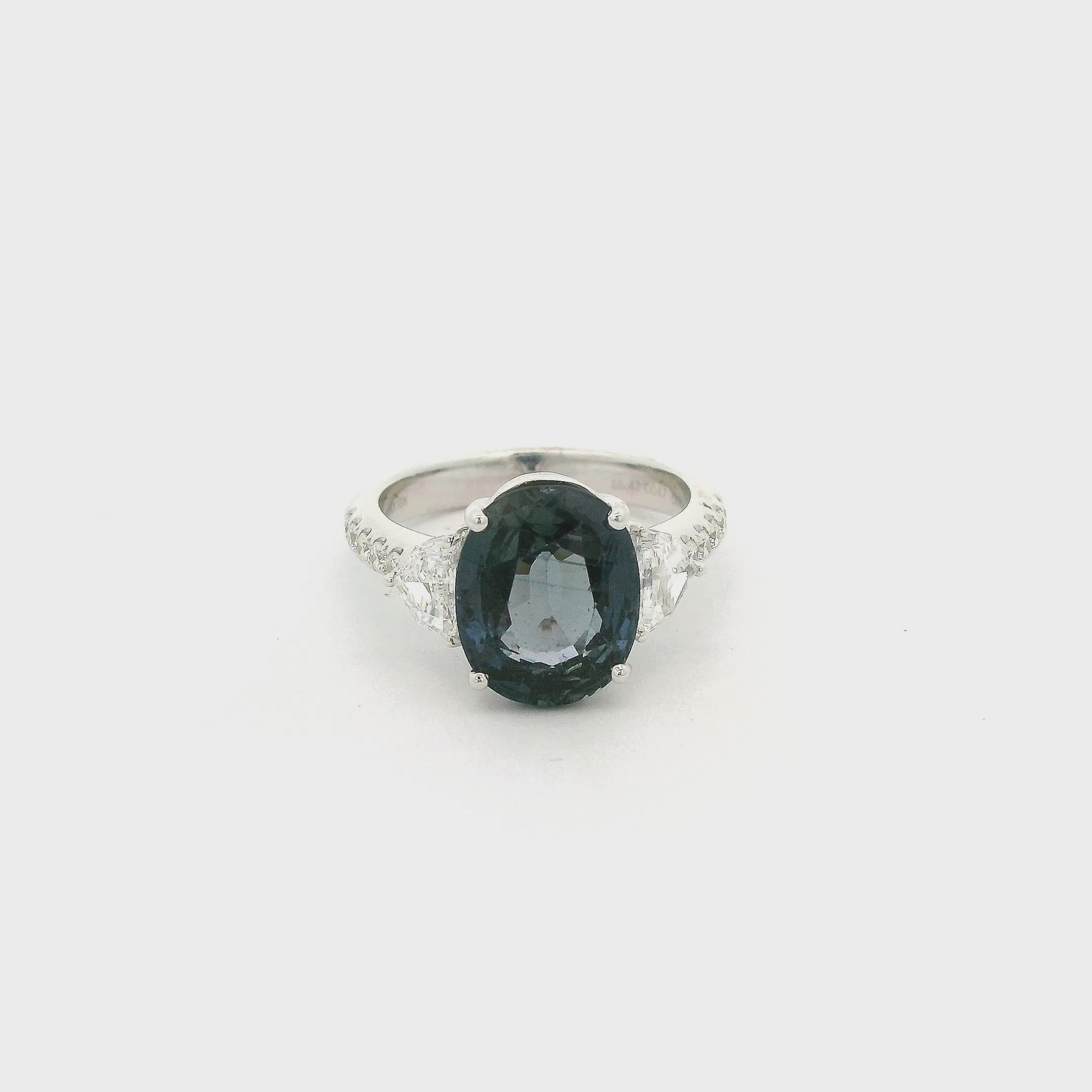A White Gold Ring with a prong set oval cut natural Color Change Sapphire in the center with two chevron cut natural diamonds and round cut diamonds Forever Rox Fine Jewelry, Lake Tahoes Best Jewelry Store