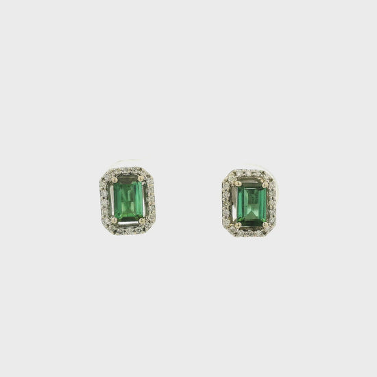 A Pair of White Gold Earrings with prong set emerald cut natural Green Tourmaline in the center with a diamond halo at Forever Rox Fine Jewelry, Lake Tahoes Best Jewelry Store