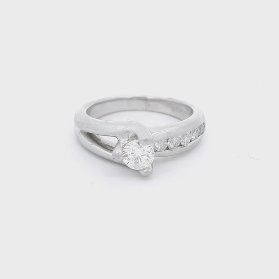 White Gold Ring with a diamond set in the center and 5 diamonds channel set down the band at Forever Rox Fine Jewelry