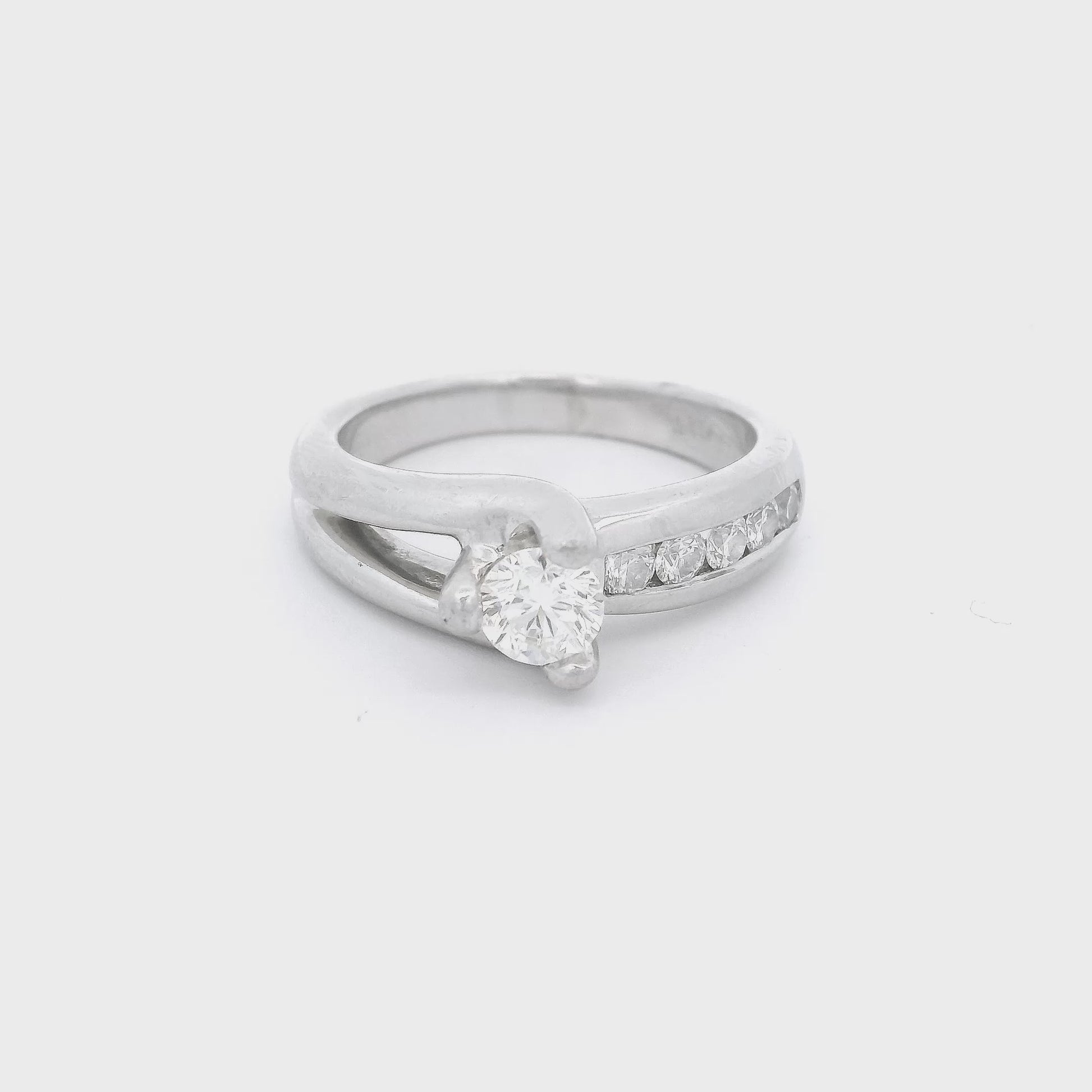 White Gold Ring with a diamond set in the center and 5 diamonds channel set down the band at Forever Rox Fine Jewelry
