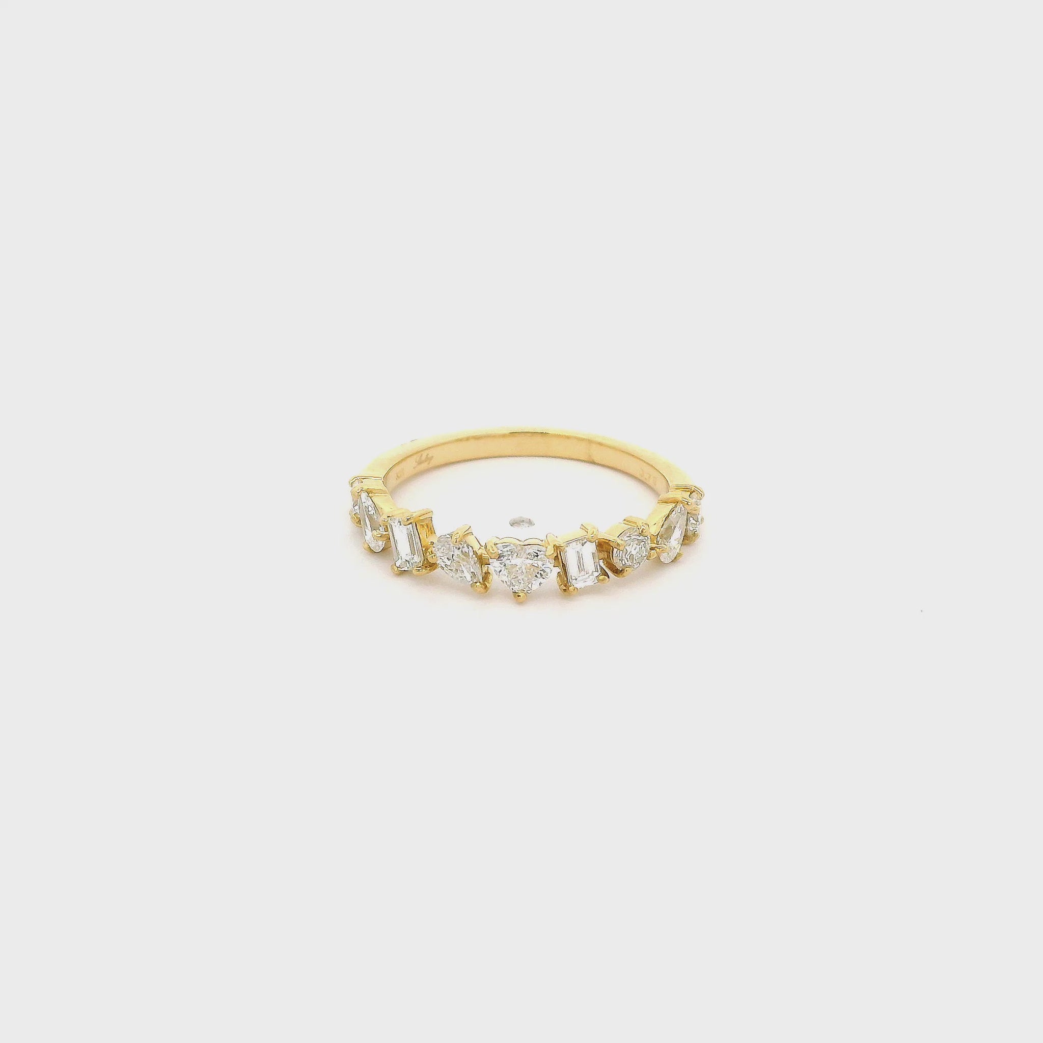 A Yellow Gold Band with heart, round, baguette & pear cut diamonds at Forever Rox Fine Jewelry, Lake Tahoes Best Jewelry Store
