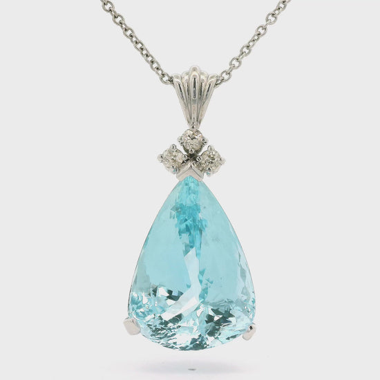 A White Gold Pendant with a prong set pear cut natural Aquamarine in the center with three round cut diamonds at Forever Rox Fine Jewelry, Lake Tahoes Best Jewelry Store