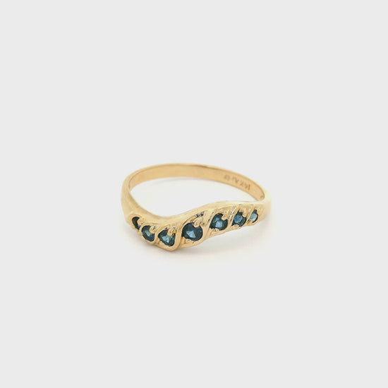 Yellow Gold Curved Stackable Band with seven blue sapphires at Forever Rox Fine Jewelry