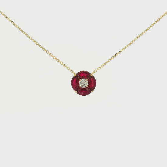 A Yellow Gold Pendant with a round cut diamond in the center & 4 marquise cut rubies in a circle around it at Forever Rox Fine Jewelry, Lake Tahoes Best Jewelry Store