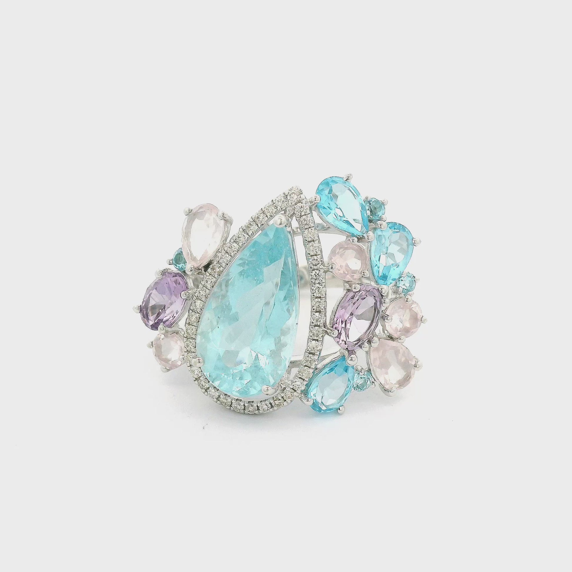 A white gold ring  featuring Aquamarine, Topaz, Morganite, Amethyst and Diamonds all different cuts and sizes at Forever Rox Fine Jewelry