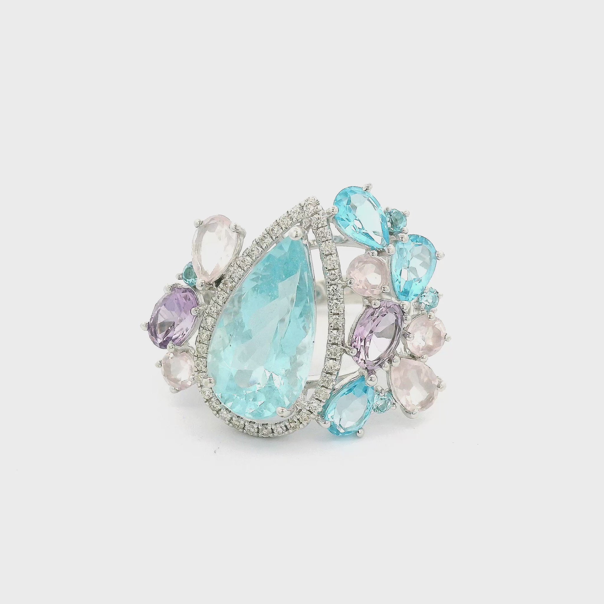 A white gold ring  featuring Aquamarine, Topaz, Morganite, Amethyst and Diamonds all different cuts and sizes at Forever Rox Fine Jewelry
