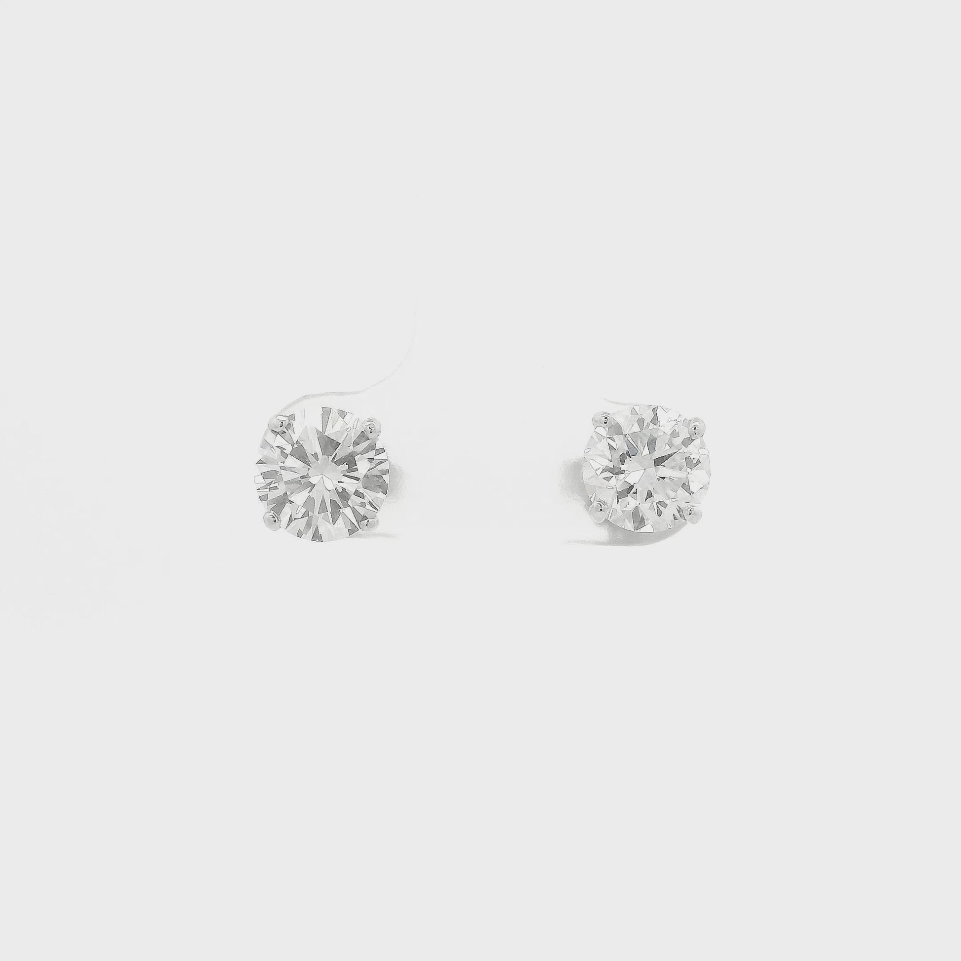 A Pair of White Gold Stud Earrings with 4 prong set round cut natural Diamonds at Forever Rox Fine Jewelry, Lake Tahoes Best Jewelry Store