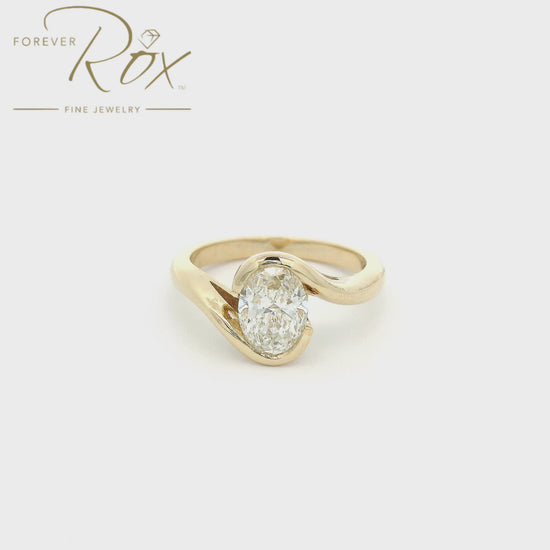 Yellow gold ring with a 1.03ct oval cut diamond set in the center custom made at Forever Rox Fine Jewelry