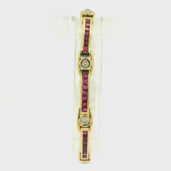 A Yellow Gold Vintage Bracelet with channel set princess cut natural Rubies and bezel set natural diamonds at Forever Rox Fine Jewelry, Lake Tahoes Best Jewelry Store
