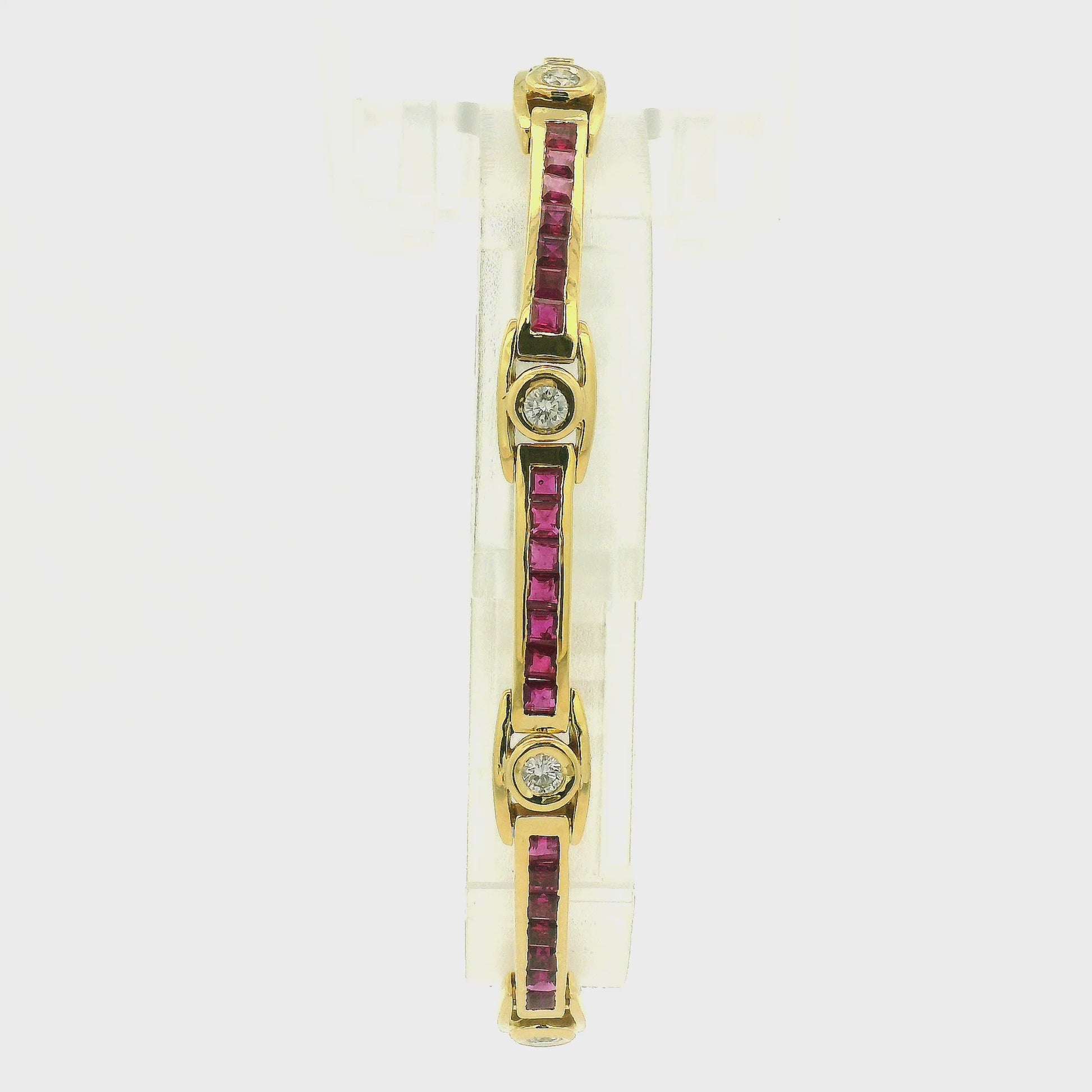A Yellow Gold Vintage Bracelet with channel set princess cut natural Rubies and bezel set natural diamonds at Forever Rox Fine Jewelry, Lake Tahoes Best Jewelry Store
