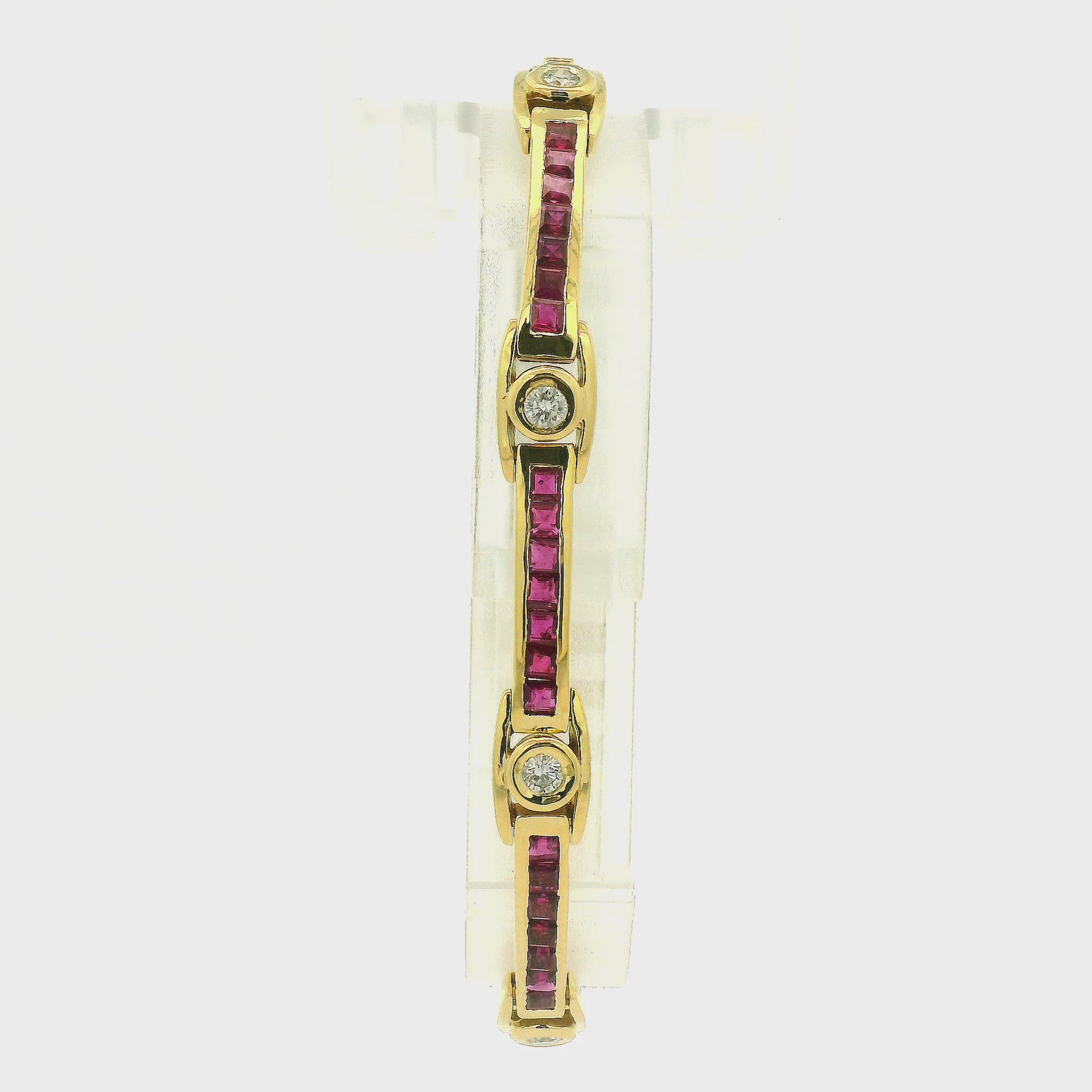 A Yellow Gold Vintage Bracelet with channel set princess cut natural Rubies and bezel set natural diamonds at Forever Rox Fine Jewelry, Lake Tahoes Best Jewelry Store
