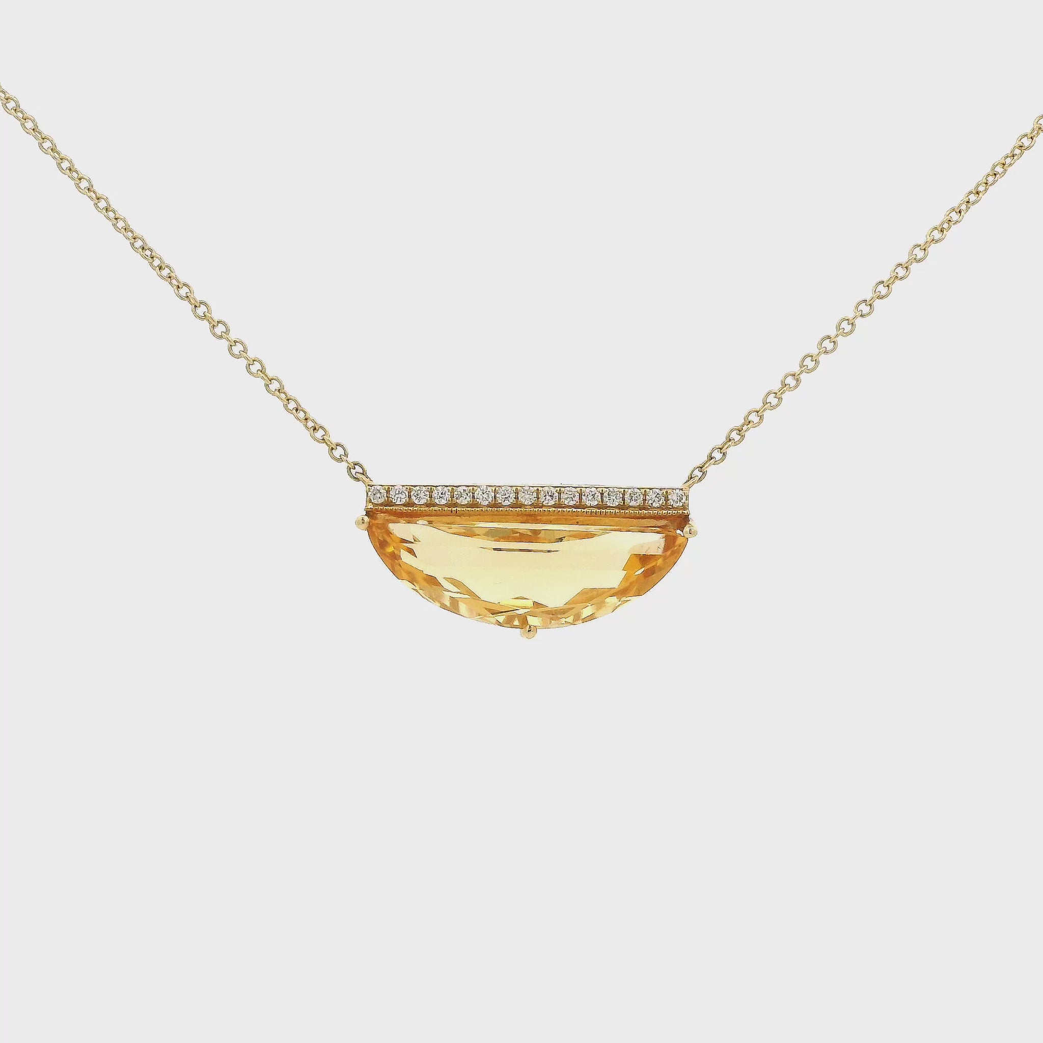 A Yellow Gold Pendant with a prong set half moon cut natural Citrine with a bar of diamonds above and a chain attached at Forever Rox Fine Jewelry, Lake Tahoes Best Jewelry Store