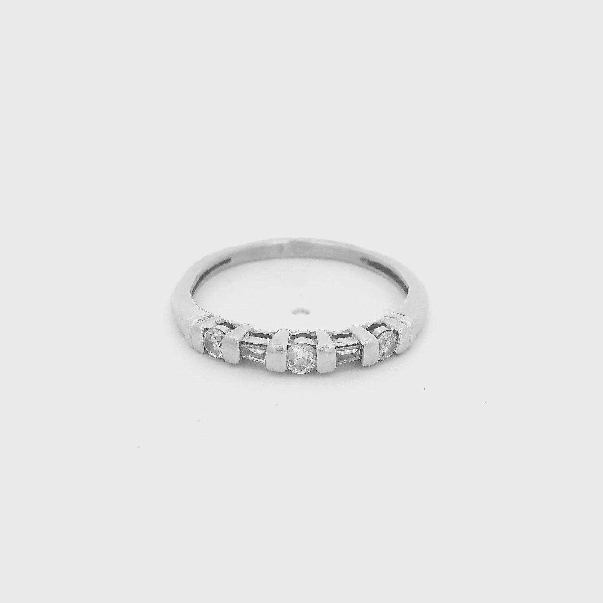 Platinum Band with three round cut and two tapered baguette cut diamonds at Forever Rox Fine Jewelry