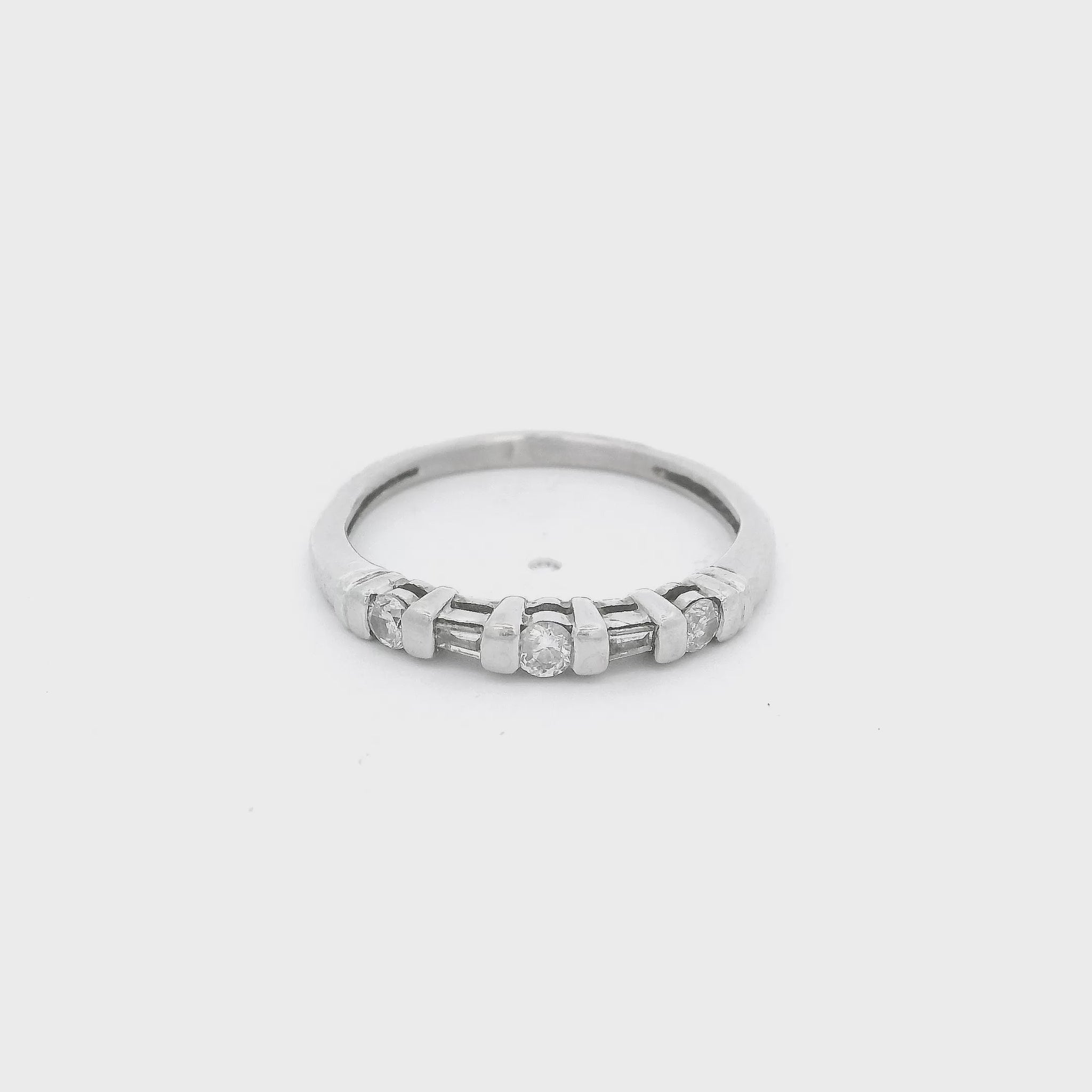 Platinum Band with three round cut and two tapered baguette cut diamonds at Forever Rox Fine Jewelry