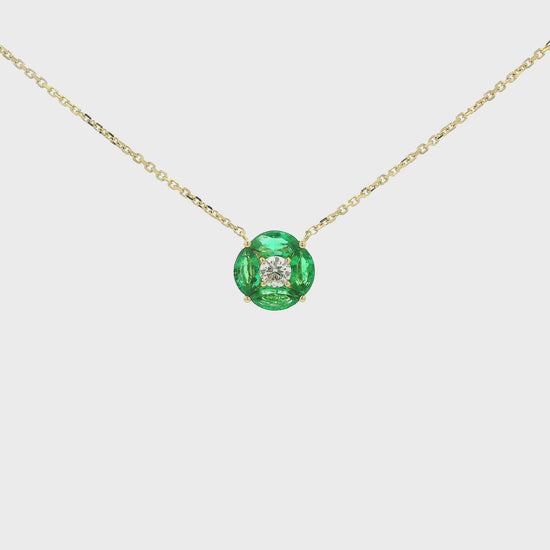 A Yellow Gold Pendant with a round cut diamond in the center & 4 marquise cut emeralds in a circle around it at Forever Rox Fine Jewelry, Lake Tahoes Best Jewelry Store