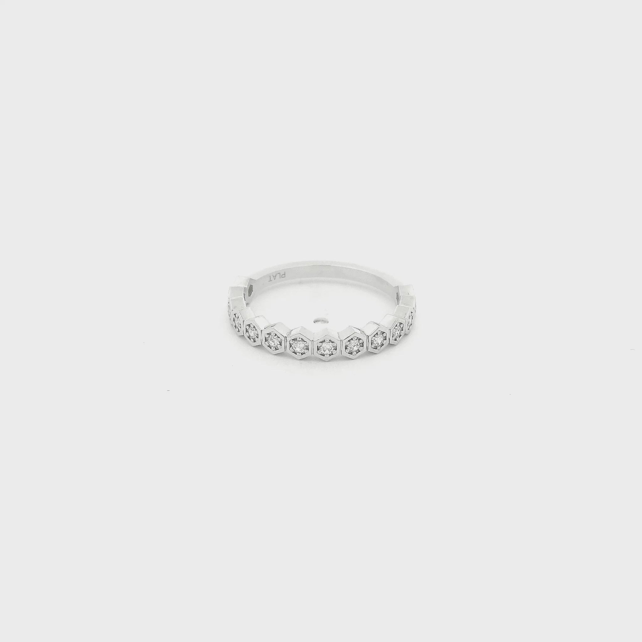 This custom platinum band features a striking row of octagon-shaped bezels, each framing a natural round brilliant cut diamond for a total of 0.18 carats of sparkle. Inspired by a matching design we carry in 14k yellow gold, this piece was custom crafted in platinum at the client’s request, giving the timeless silhouette a luxurious and enduring finish. The combination of geometric elegance, natural diamonds, and platinum’s exceptional durability makes this band a beautiful expression of personalized fine j