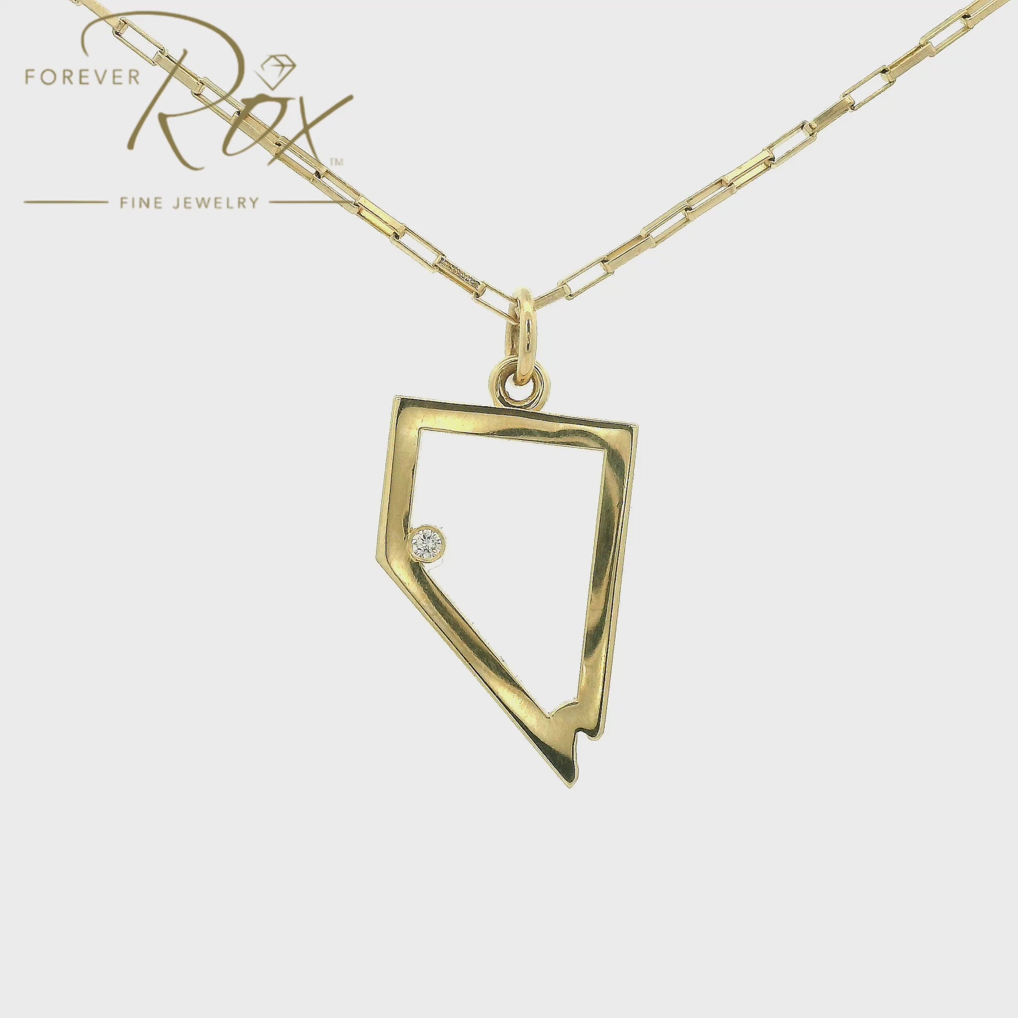 A Yellow Gold Nevada Outline Pendant with a bezel set round cut natural Diamond where Lake Tahoe is at Forever Rox Fine Jewelry, Lake Tahoes Best Jewelry Store