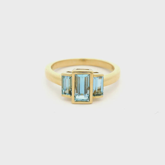 3 Baguette cut Aquamarines set in a yellow gold ring Forever Rox Fine Jewelry