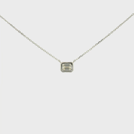 A White Gold Pendant with a bezel set emerald cut natural Diamond in the center at Forever Rox Fine Jewelry, Lake Tahoes Best Jewelry Store
