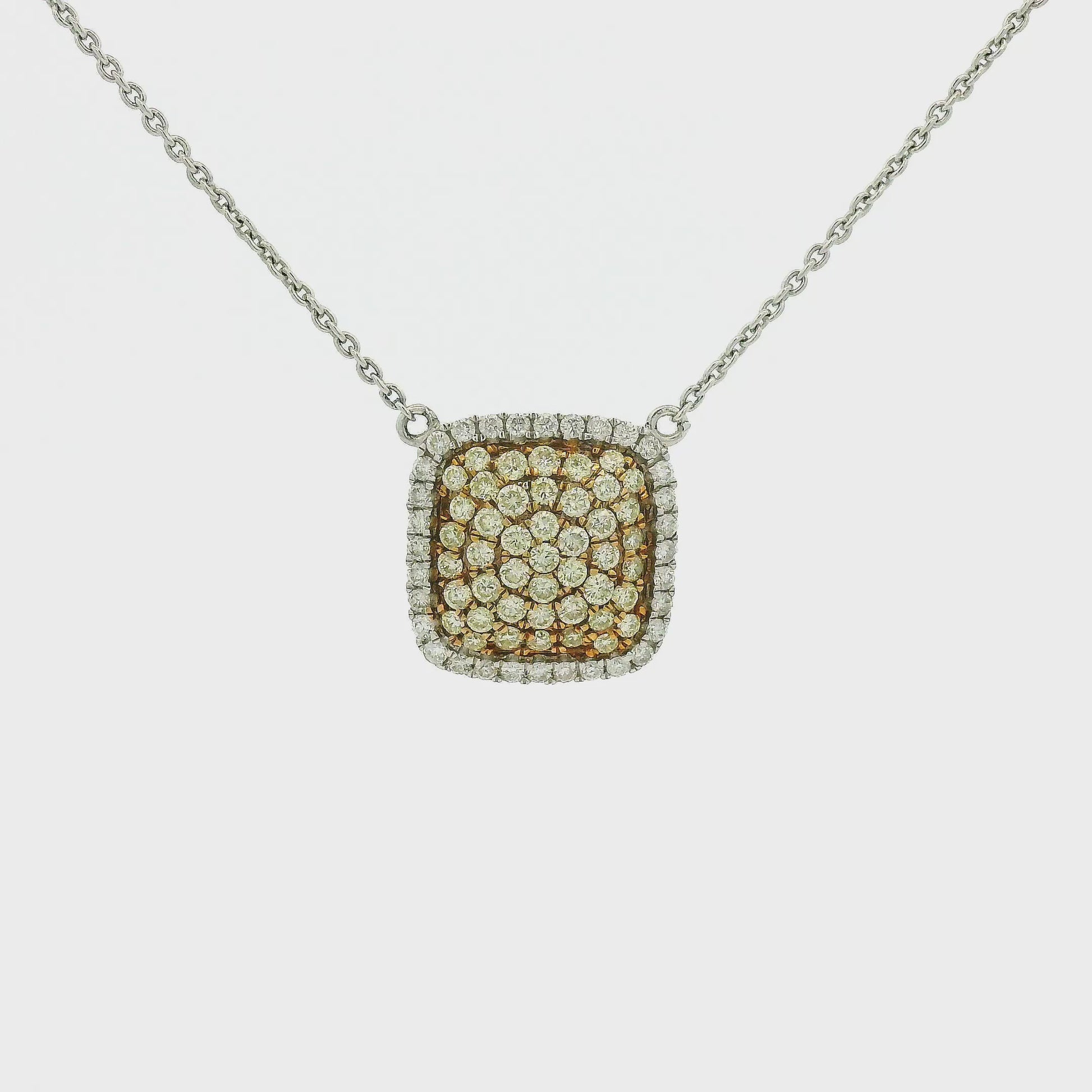 A White Gold Pendant with pavé set round cut natural Yellow & White Diamonds with a chain attached at Forever Rox Fine Jewelry, Lake Tahoes Best Jewelry Store
