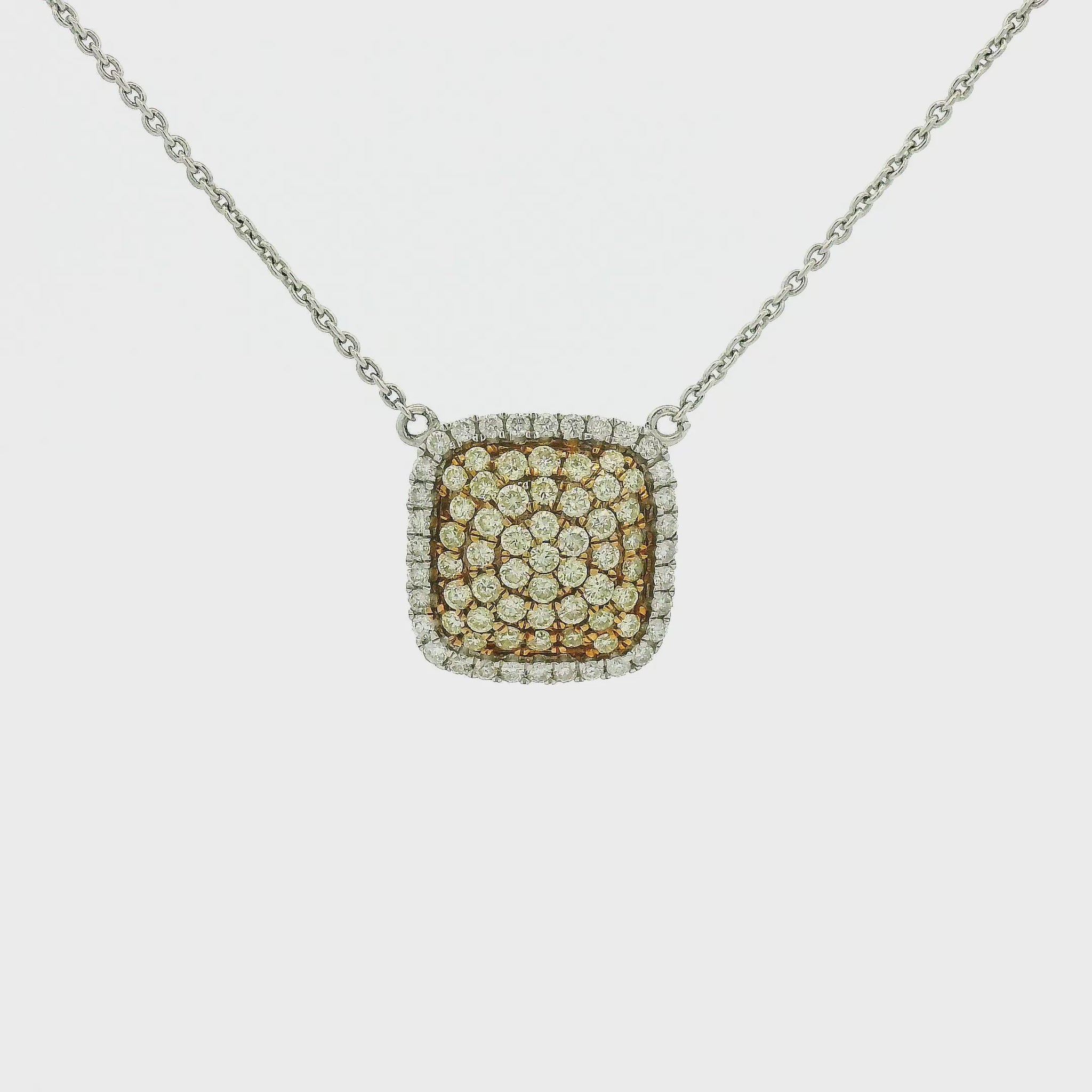 A White Gold Pendant with pavé set round cut natural Yellow & White Diamonds with a chain attached at Forever Rox Fine Jewelry, Lake Tahoes Best Jewelry Store