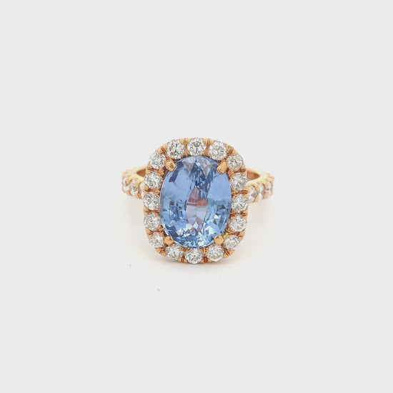 Rose Gold Ring with an oval cut blue ceylonese sapphire set in the center with diamonds at Forever Rox Fine Jewelry 