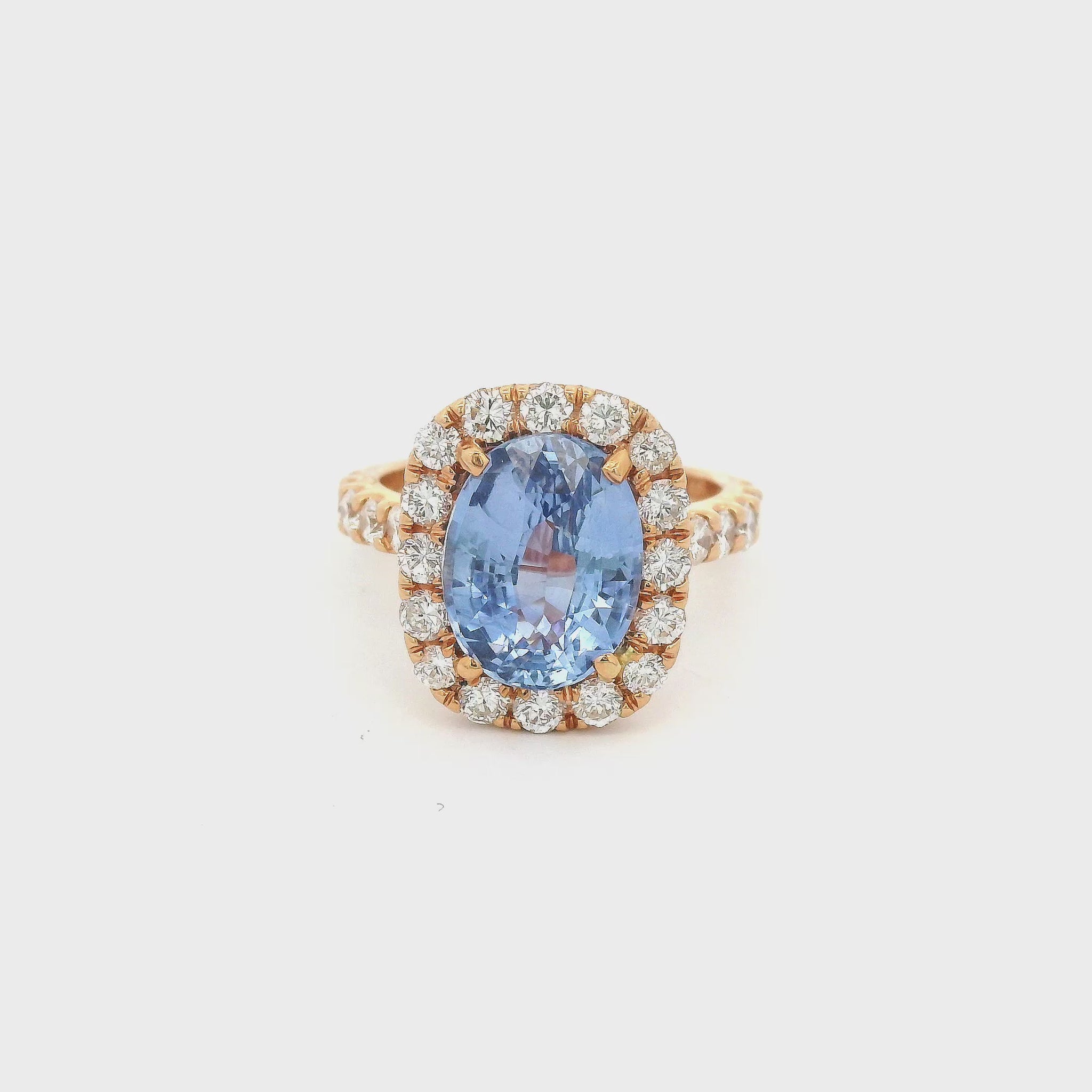 Rose Gold Ring with an oval cut blue ceylonese sapphire set in the center with diamonds at Forever Rox Fine Jewelry 