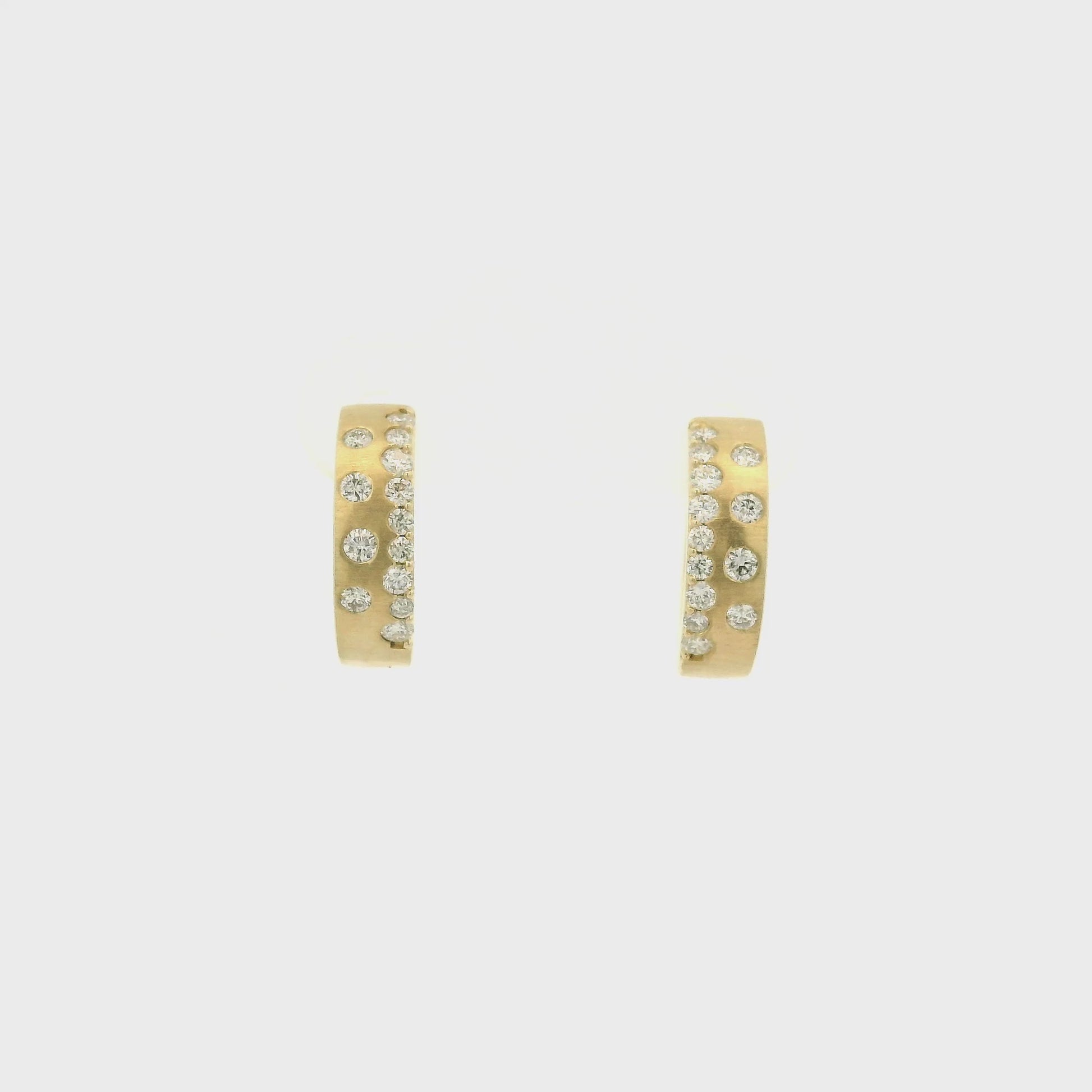 A Pair of Yellow Gold Hoop Earrings with flush set round cut natural Diamonds at Forever Rox Fine Jewelry, Lake Tahoes Best Jewelry Store