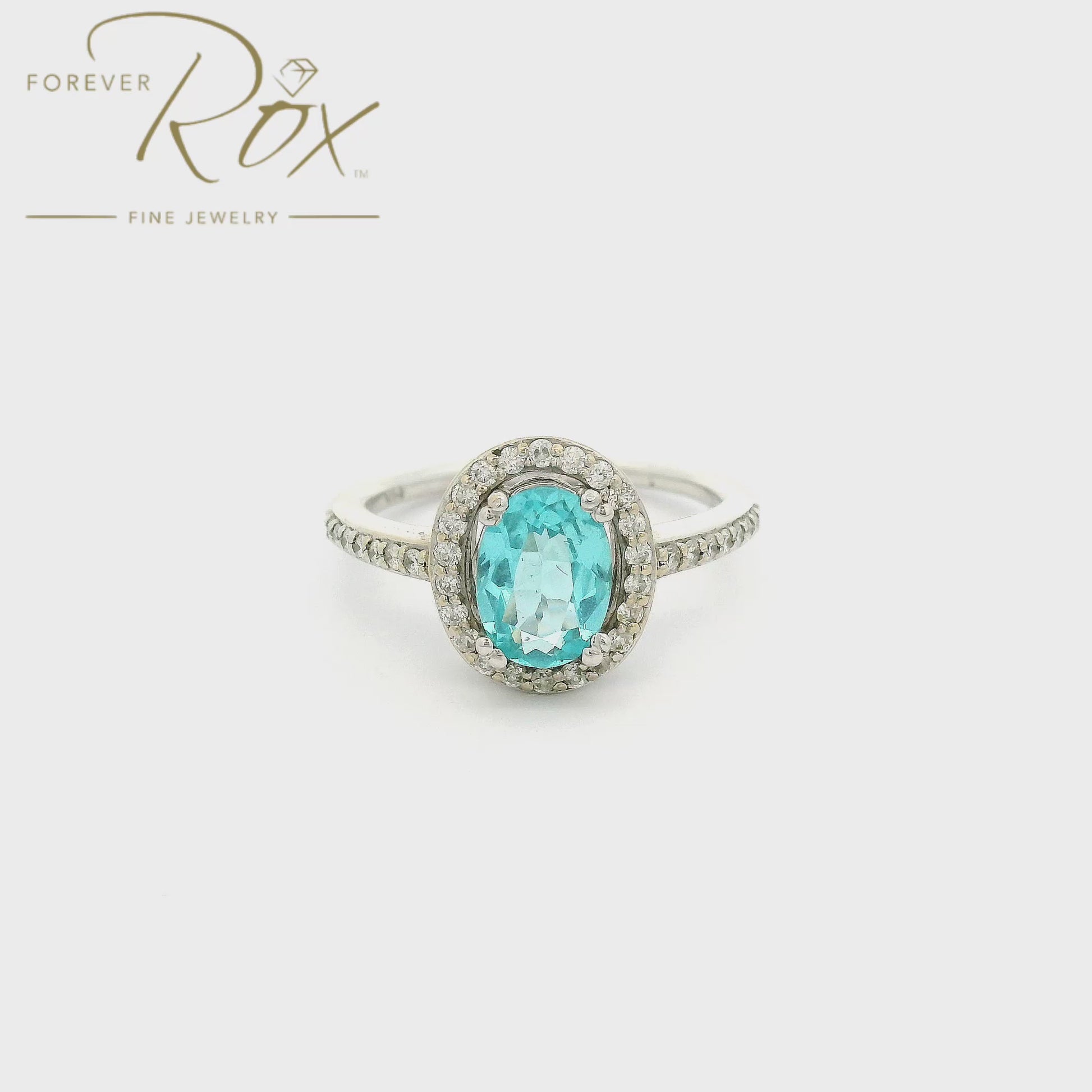 A White Gold Ring with a prong set oval cut Apetite in the center with a halo of diamonds and diamonds down the shank at Forever Rox Fine Jewelry, Lake Tahoes Best Jewelry Store