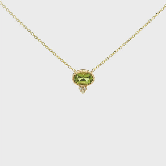 A Yellow Gold Pendant with a milgrain bezel set oval cut natural Peridot in the center with 3 diamonds and a chain attached at Forever Rox Fine Jewelry, Lake Tahoes Best Jewelry Store
