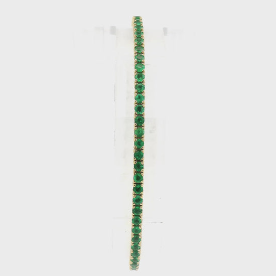 A Yellow Gold Bangle Bracelet with prong set Emeralds at Forever Rox Fine Jewelry, Lake Tahoes Best Jewelry Store