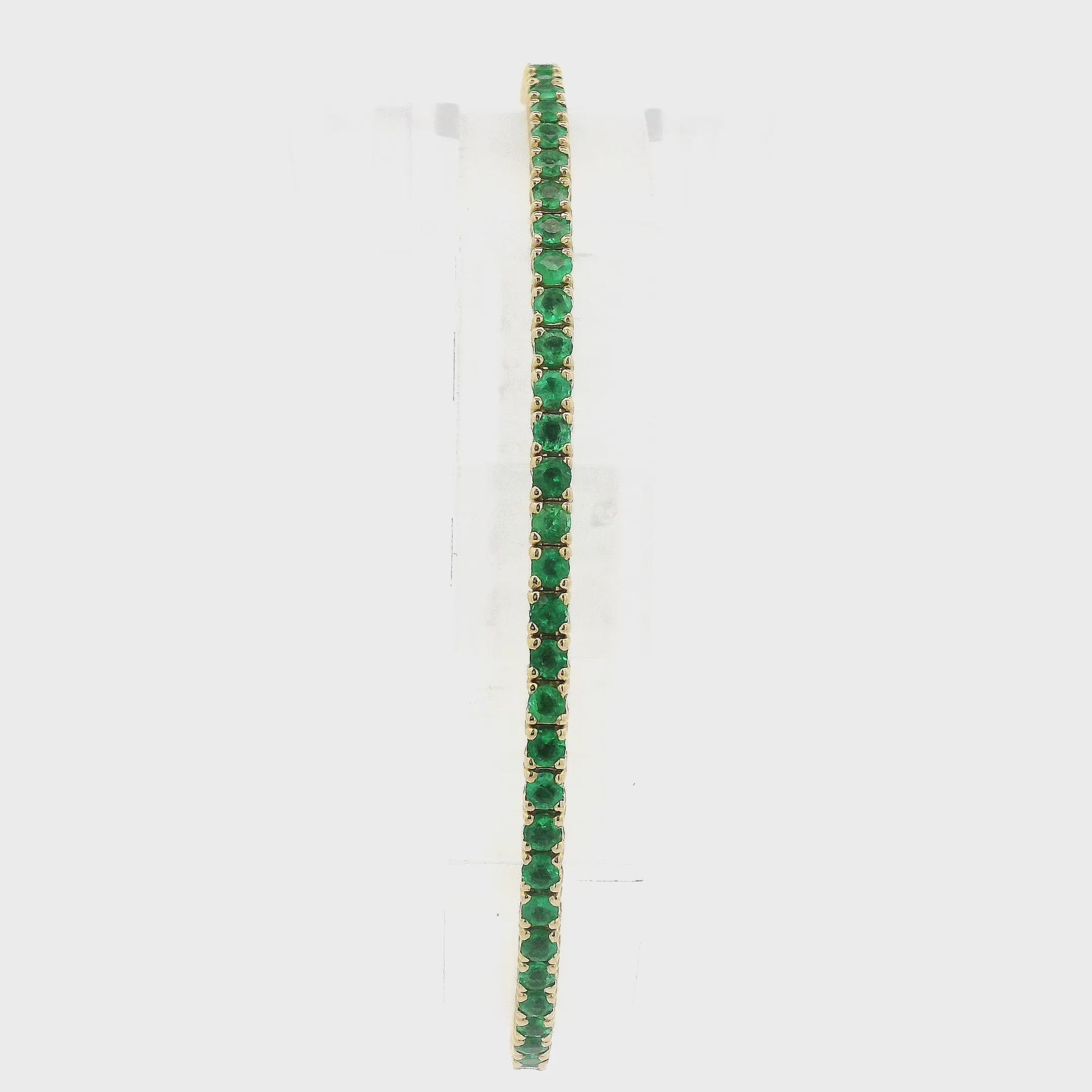 A Yellow Gold Bangle Bracelet with prong set Emeralds at Forever Rox Fine Jewelry, Lake Tahoes Best Jewelry Store