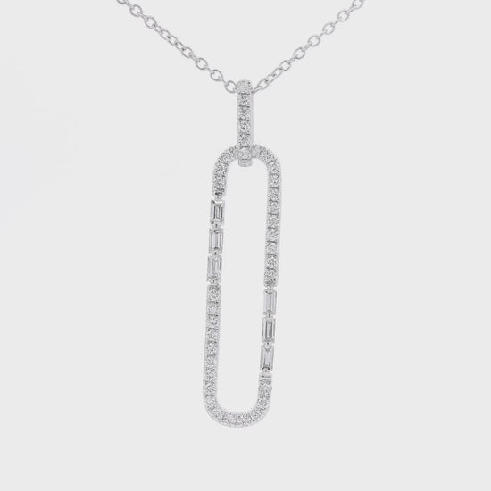 A White Gold Long Oval Shape Pendant with a round & baguette cut Diamonds around it at Forever Rox Fine Jewelry, Lake Tahoes Best Jewelry Store
