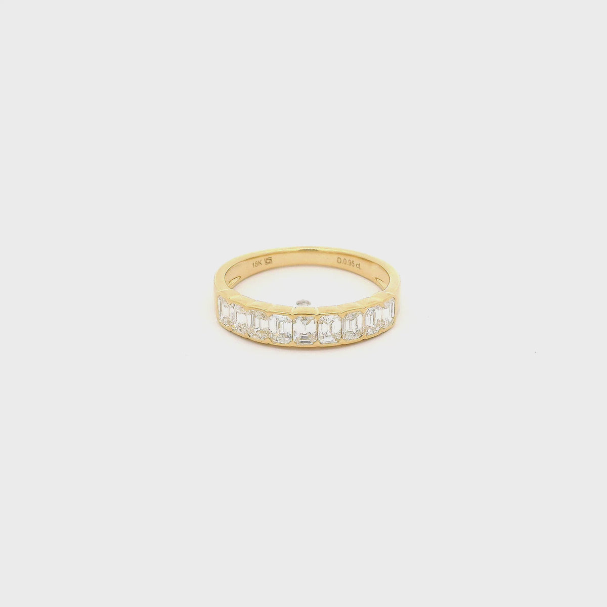 A Yellow Gold Band with channel set emerald cut natural Diamonds in the center at Forever Rox Fine Jewelry, Lake Tahoes Best Jewelry Store
