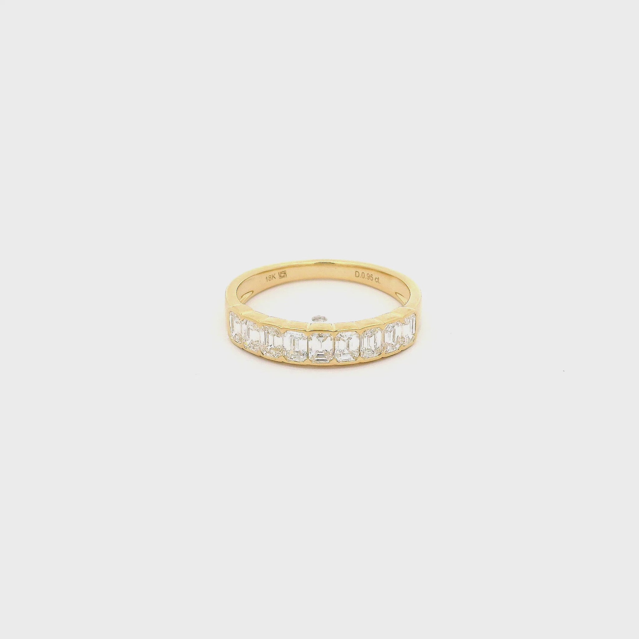 A Yellow Gold Band with channel set emerald cut natural Diamonds in the center at Forever Rox Fine Jewelry, Lake Tahoes Best Jewelry Store

