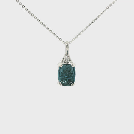 A White Gold Pendant with a prong set oval cut London Blue Topaz in the center with a bead behind it to help it sparkle and a Diamond set above the Topaz at Forever Rox Fine Jewelry, Lake Tahoes Best Jewelry Store